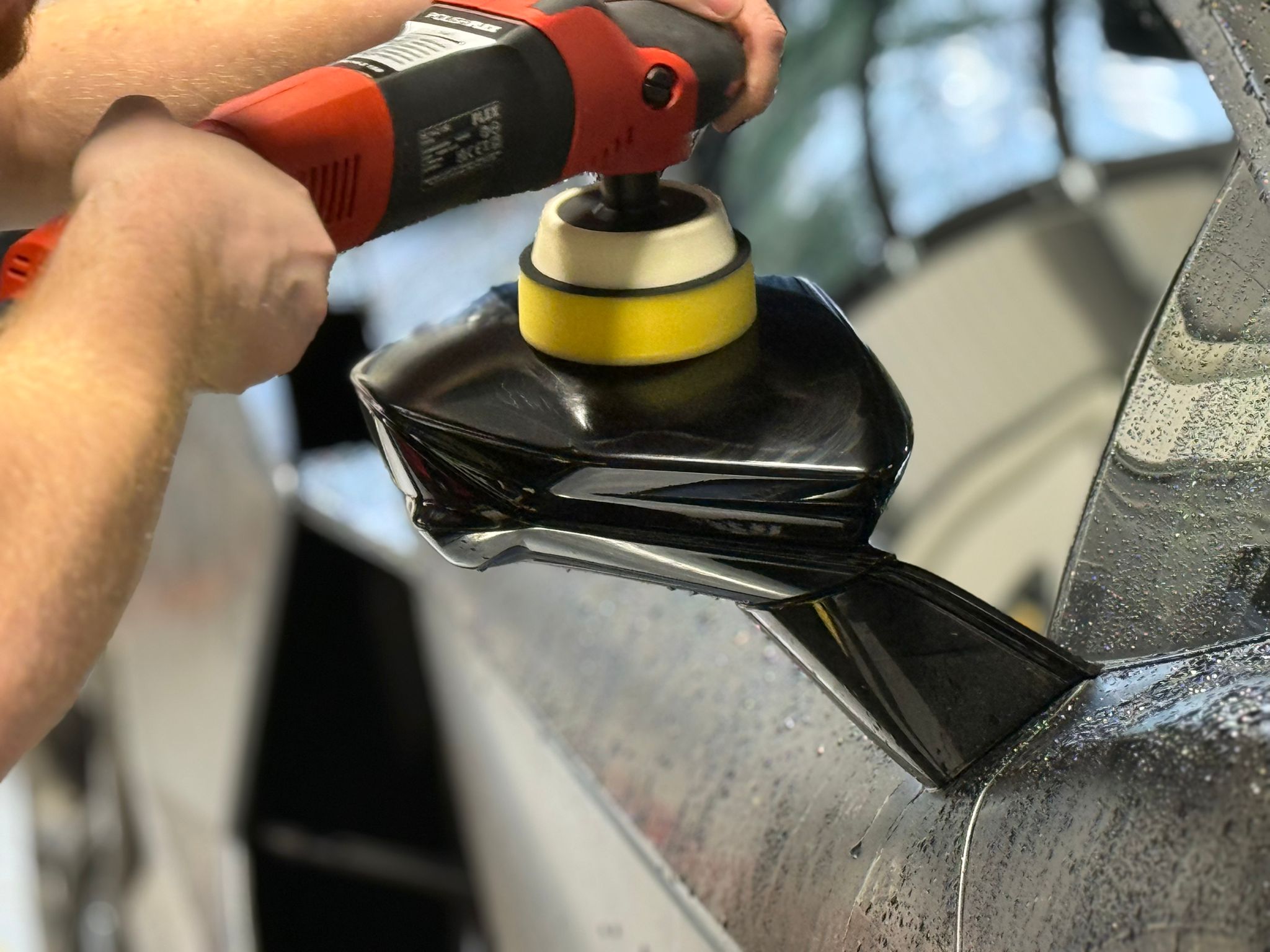 Machine polishing a vehicle panel at Prestige Protect Reading