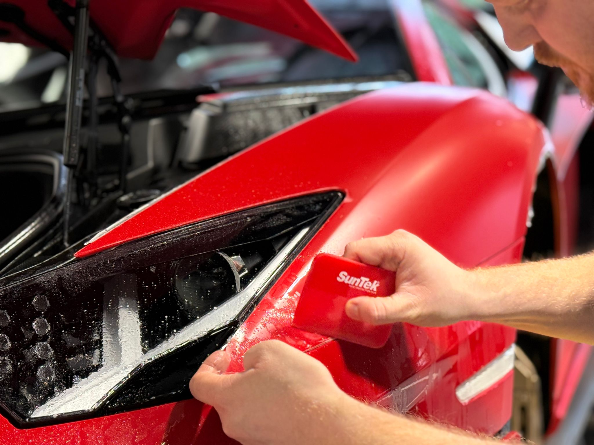 SunTek PPF installation on red Lamborghini at Prestige Protect Reading